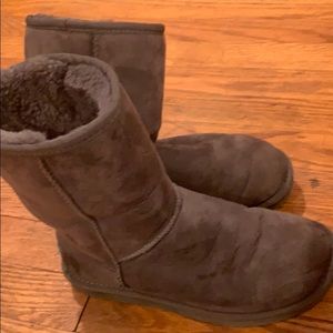 Worn grey UGG boots